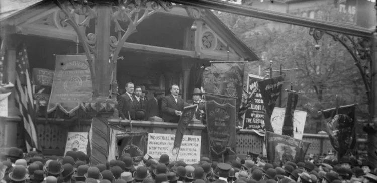 black and white photo of men speaking to a crowd