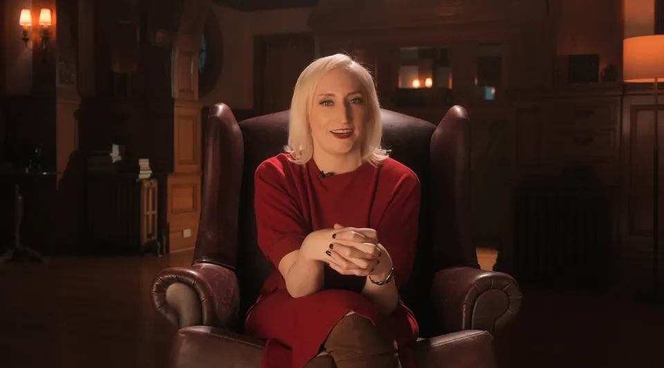 dr kerry mcelroy sitting on a couch